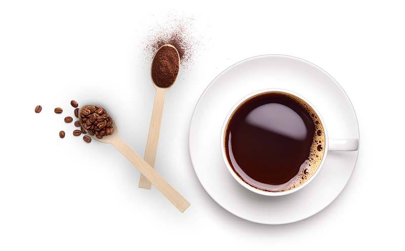 Coffee cup with wooden spoons