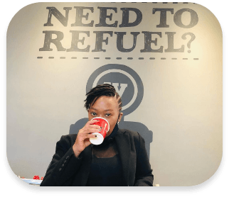 Person drinking coffee with text need to refuel?