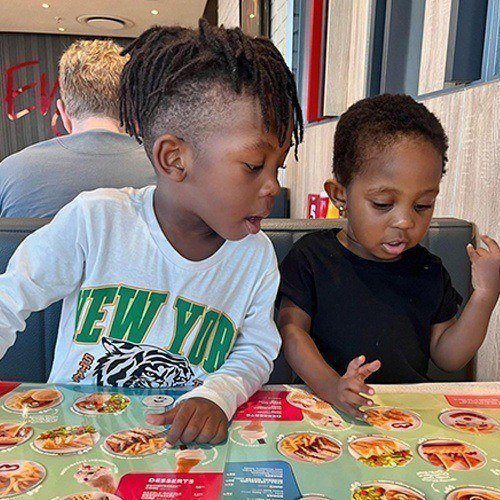 Little kids looking at Wimpy’s menu