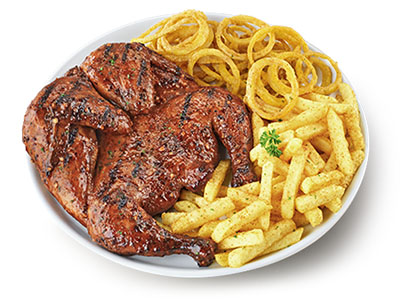 Full chicken with onion rings and chips on a white plate