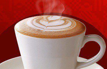 A cup of coffee with steam coming off it