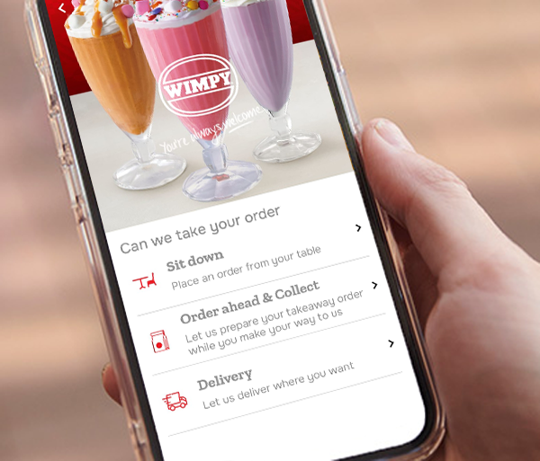 Person holding phone with rewards app