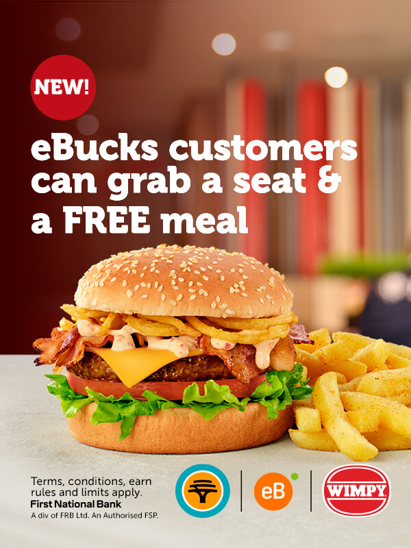large burger with cheese, bacon, onion rings, lettuce, and sauce, served with seasoned fries.
