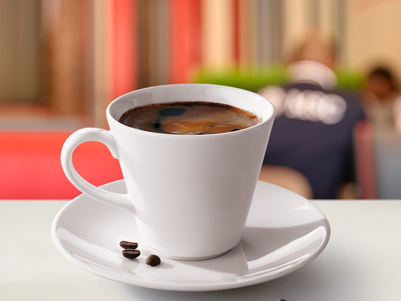 Africano coffee in a white cup