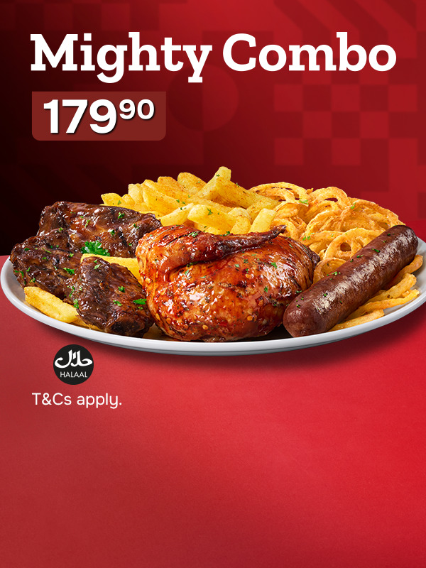 Hearty barbecue platter loaded with roasted chicken, glazed ribs, wors, french fries, and onion rings